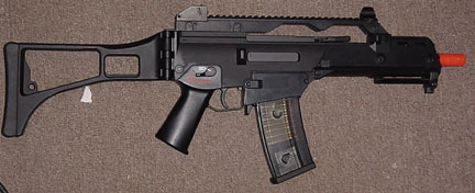 Nice carpet huh? Gotta love that 1970s brown crap. Oh, yeah, there's an HK G36c in there somplace...